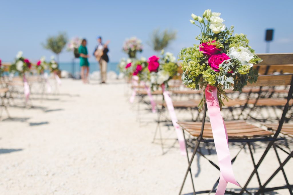 Where to get married? A wedding on a beach with folding chairs